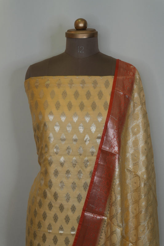 Reshamnagari Beige Banarasi Chanderi Suit Set with Red Zari Border Dupatta